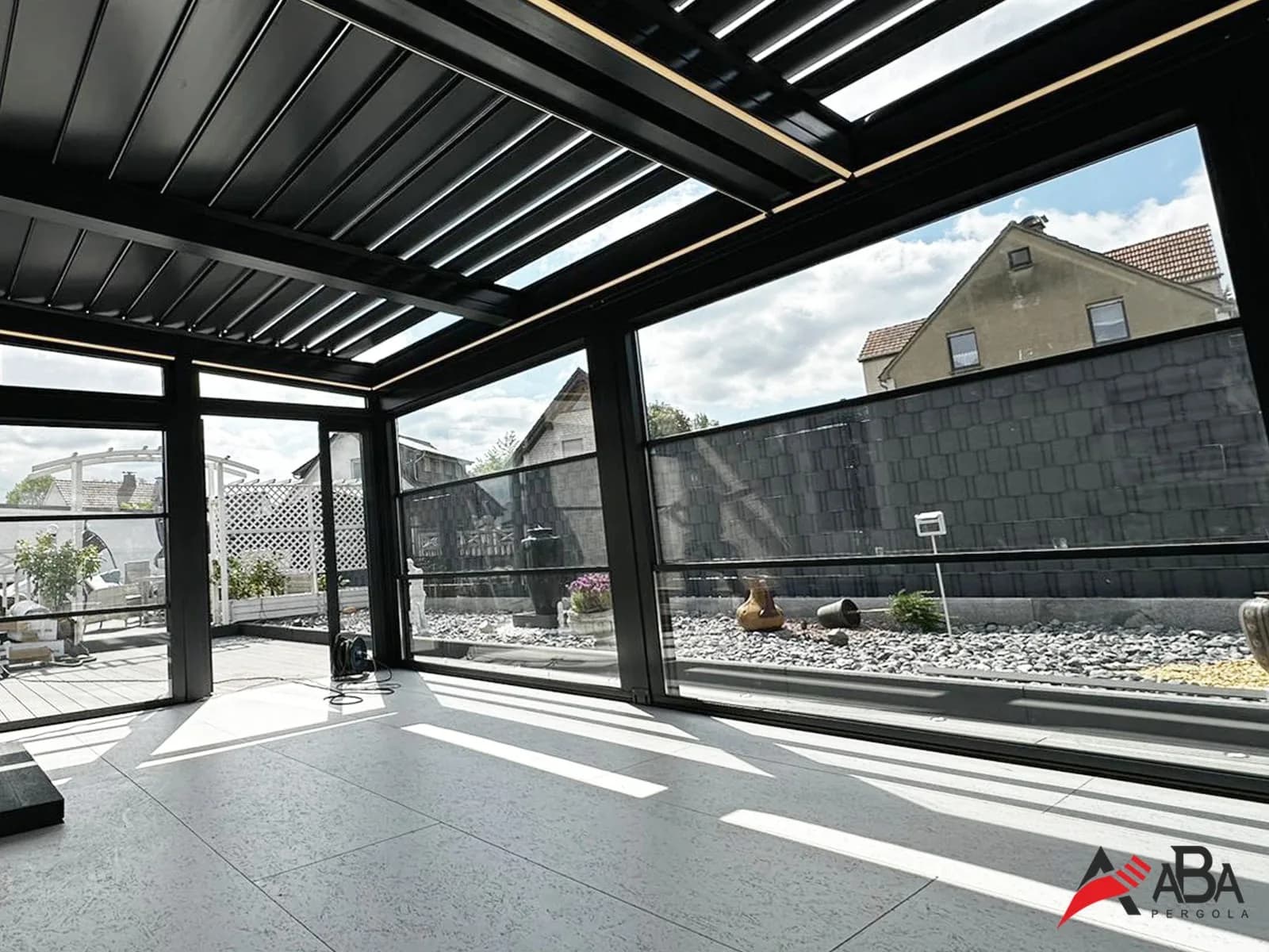 Modern white house with elegant winter garden glass extension